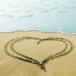 heart writing on beach